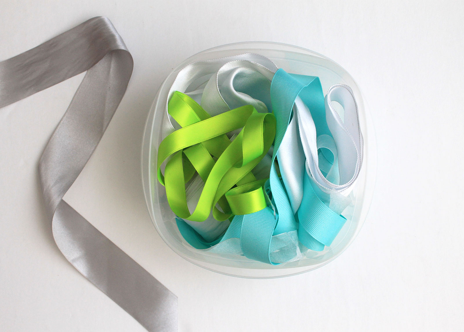 Repurpose plastic containers to store crafting supplies