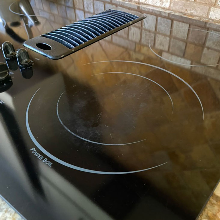 How to remove cloudiness from a glass stove top